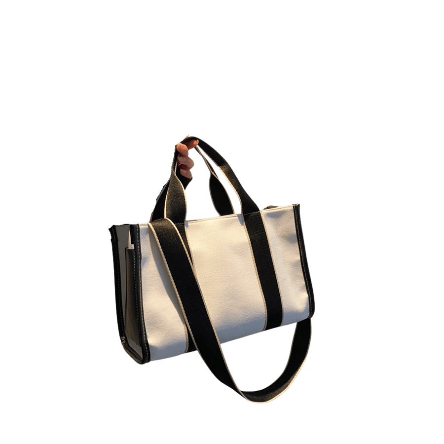 White canvas ladies tote bag with black trim canvas and stripe webbing