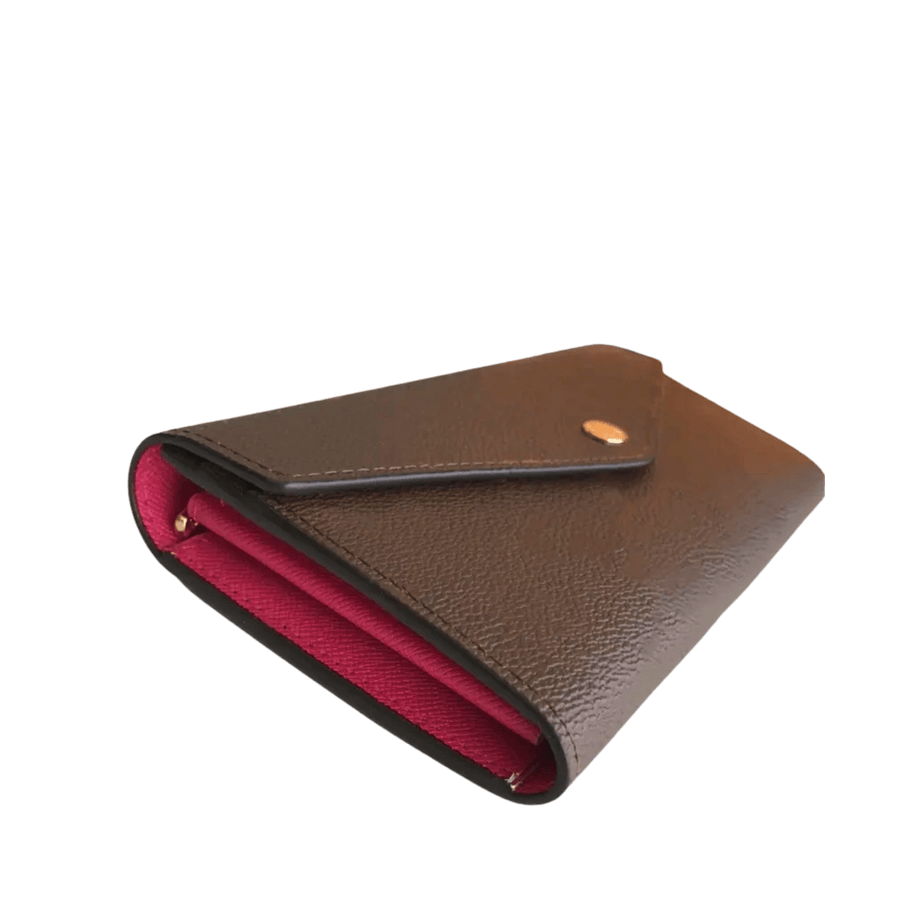 Brown ladies wallet with red cc slots and snap closure