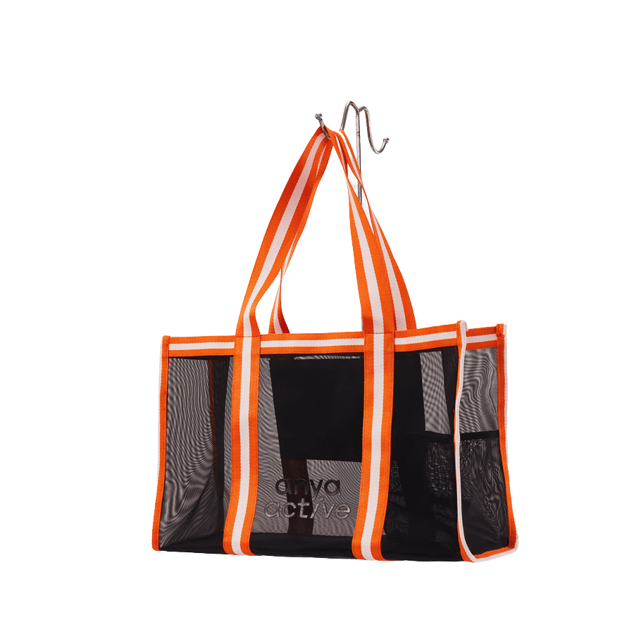 Black mesh beach bag with stripe webbing and magnetic snap closure