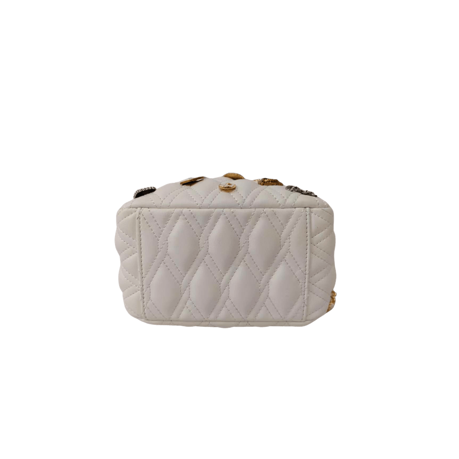 White quilting ladies drawstring bag with decorative accessories and metal stopper