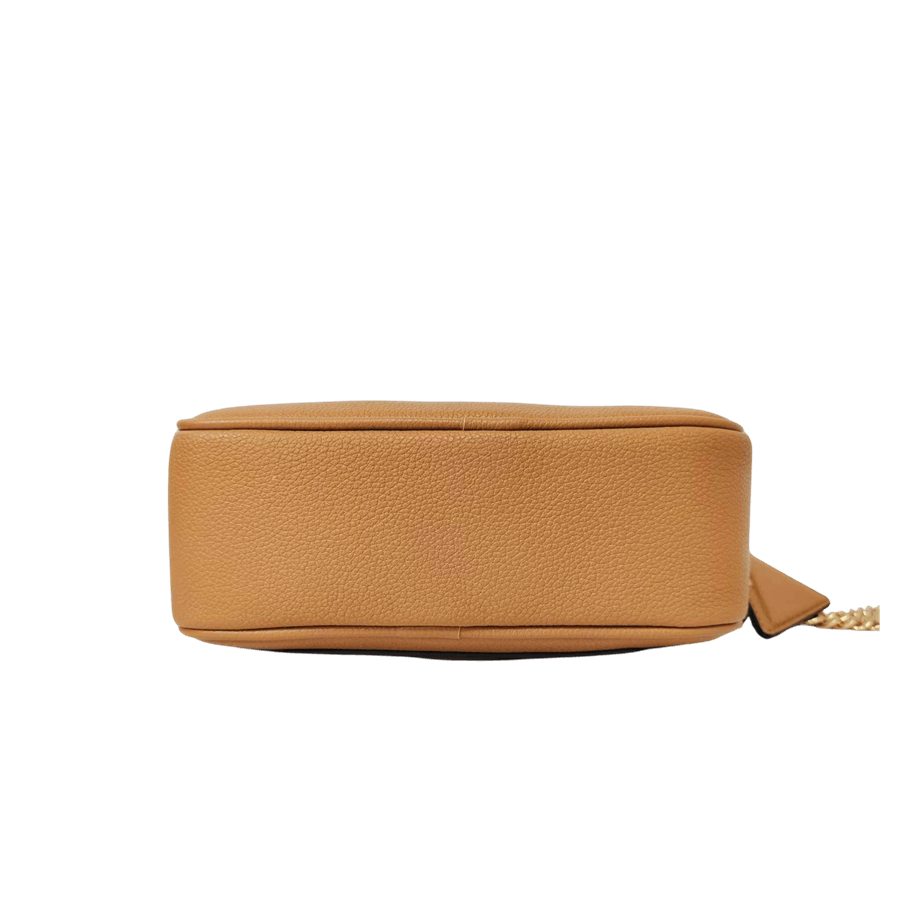 Camel ladies crossbod bag with decorative metal plate and detachable hangtag