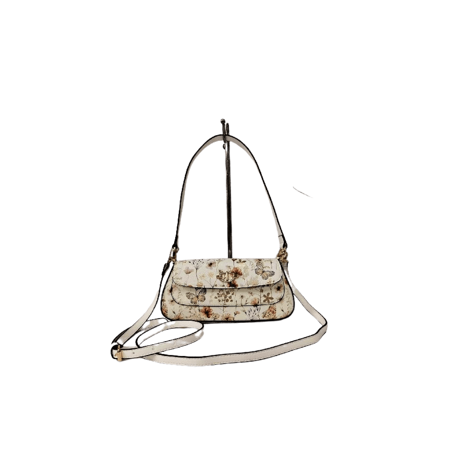 Floral print ladies handbag with decorative hardware on the flap and magnetic snap closure