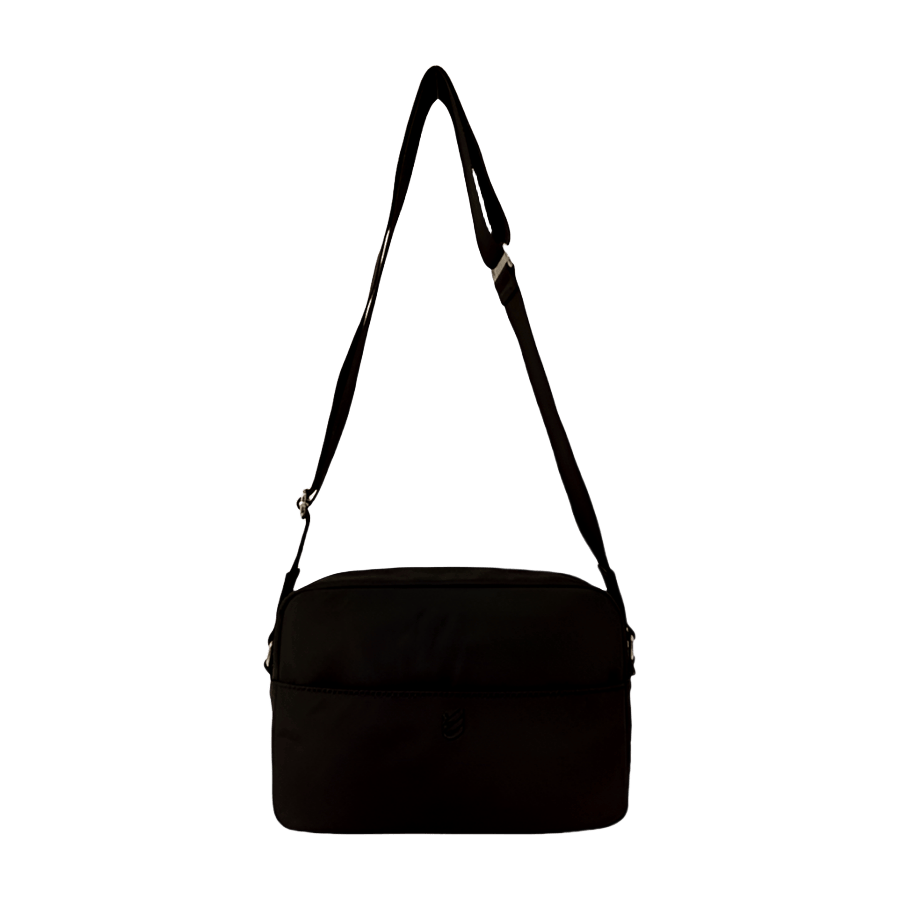 Black crossbody bag with front open pocket and black enemal metal plate