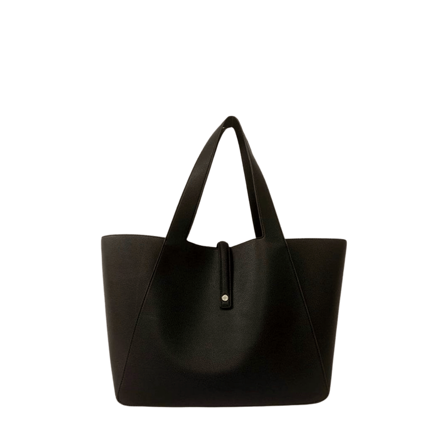 Black ladies tote bag with magnetic snap closure and decorative stud on the small flap
