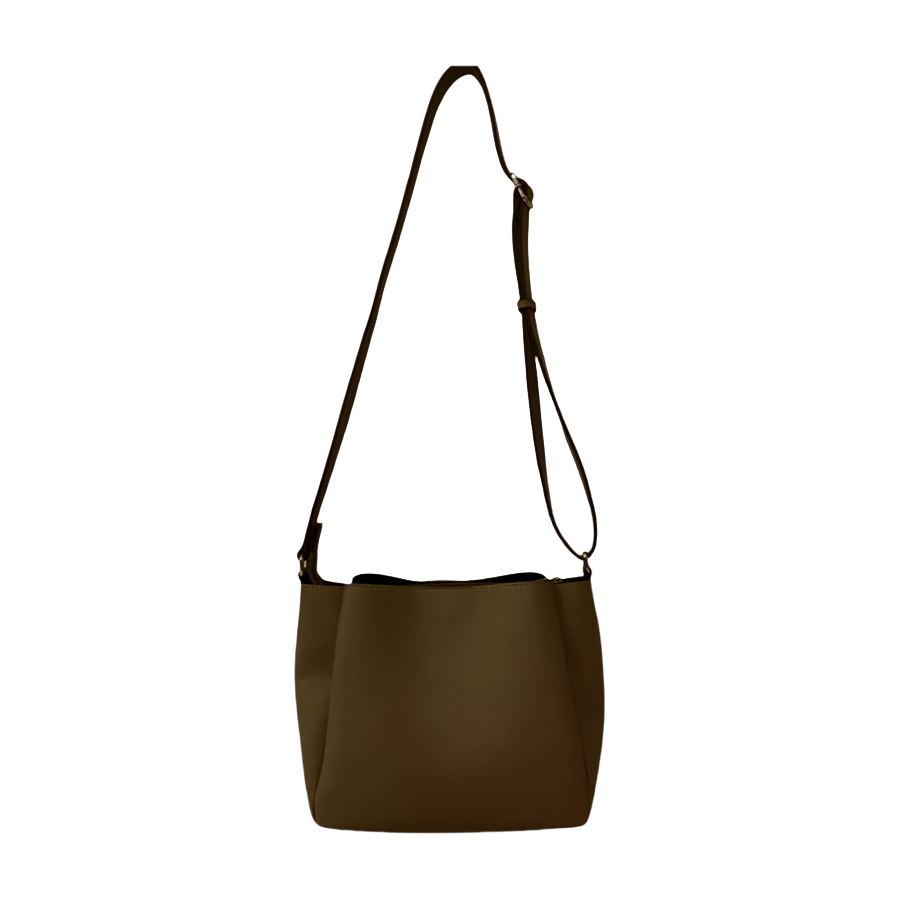 Grey ladies crossbody bag with magnetic snap closure and metal edge on the top