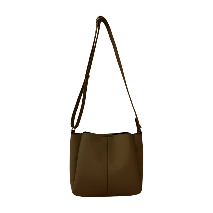 Grey ladies crossbody bag with magnetic snap closure and metal edge on the top