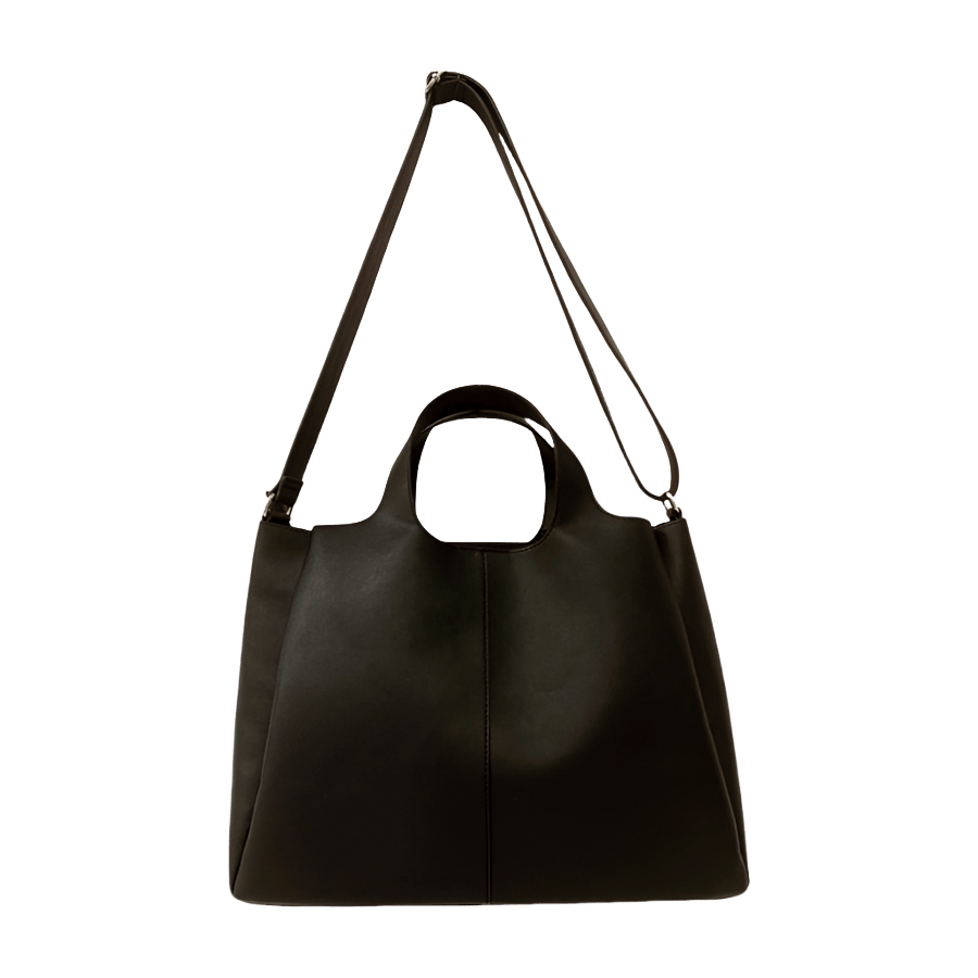 Black ladies handbag with magnetic snap closure and metal edge on the top
