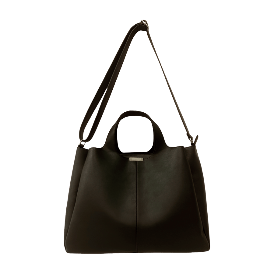 Black ladies handbag with magnetic snap closure and metal edge on the top