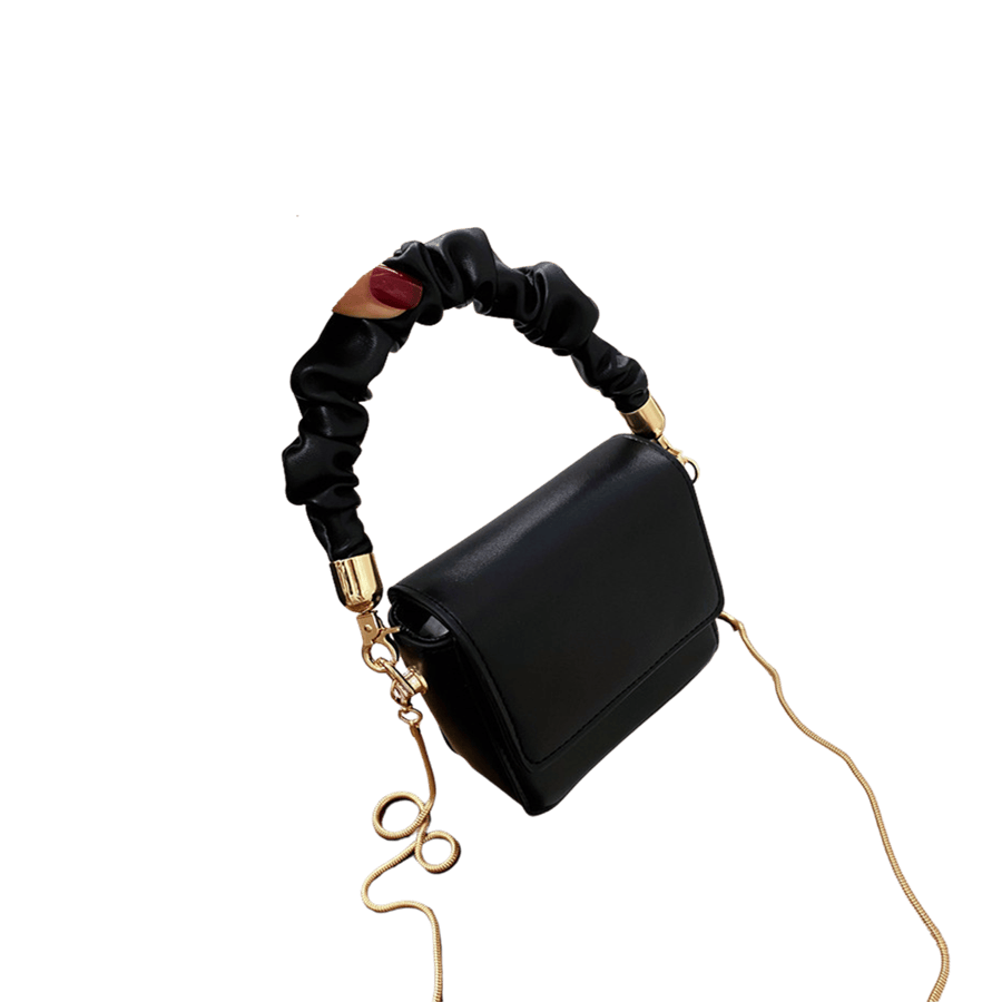 Black ladies handbag with plicated handle and magnetic snap closure