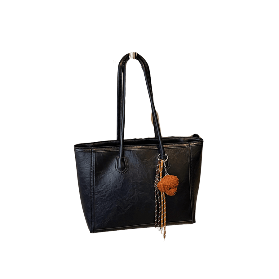 Black ladies tote with string and pompom hangtag