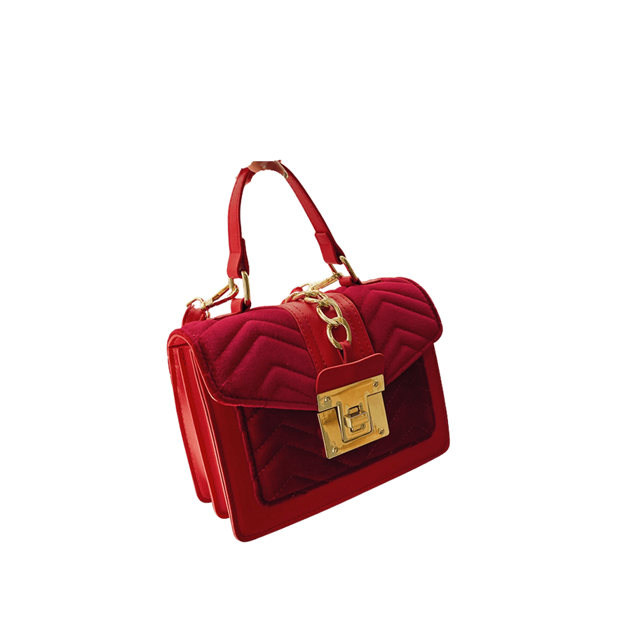Red ladies handbag with matching faux suede trim material and lock closure