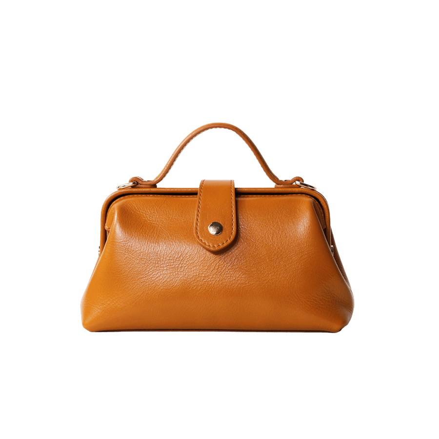 Brown ladies handbag with magnetic snap closure and decorative studs on the sides