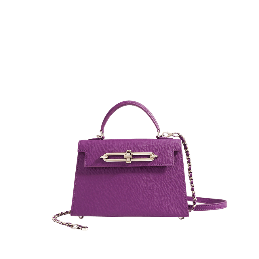 Purple ladies handbag with decorative lock closure
