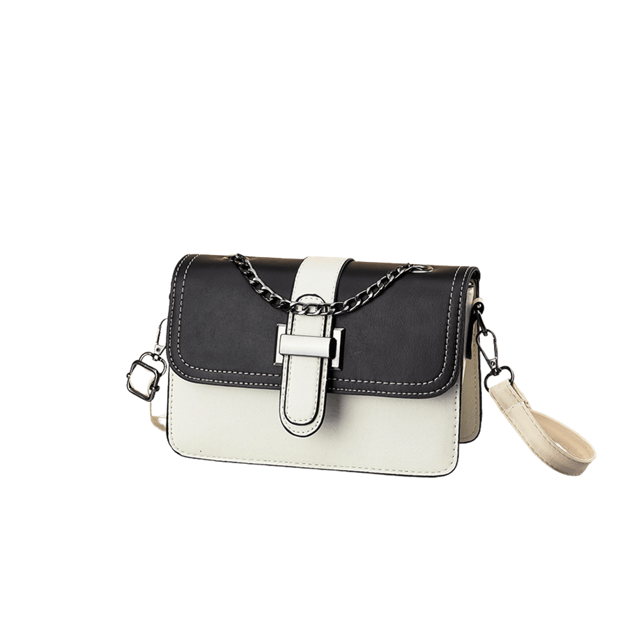 Beige ladies crossbody bag with black flap and metal bridge on the flap