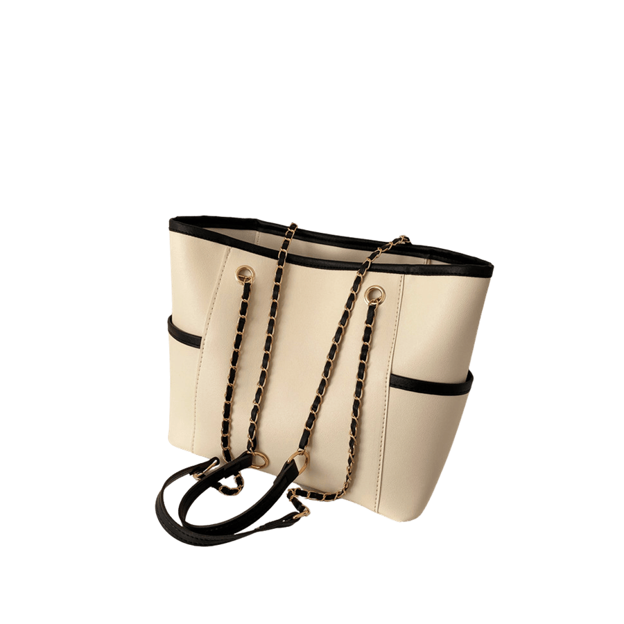 Beige ladies handbag with chain handle and black trim PU