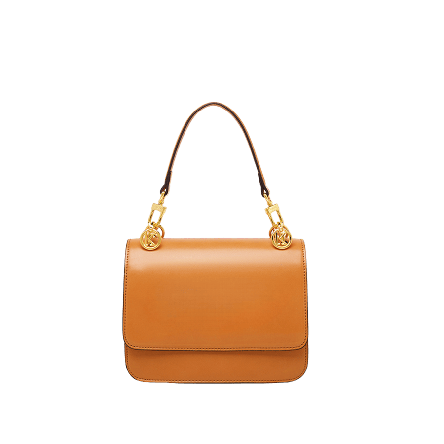 Orange ladies handbag with decorative hardware on the handle and contrast edge painting
