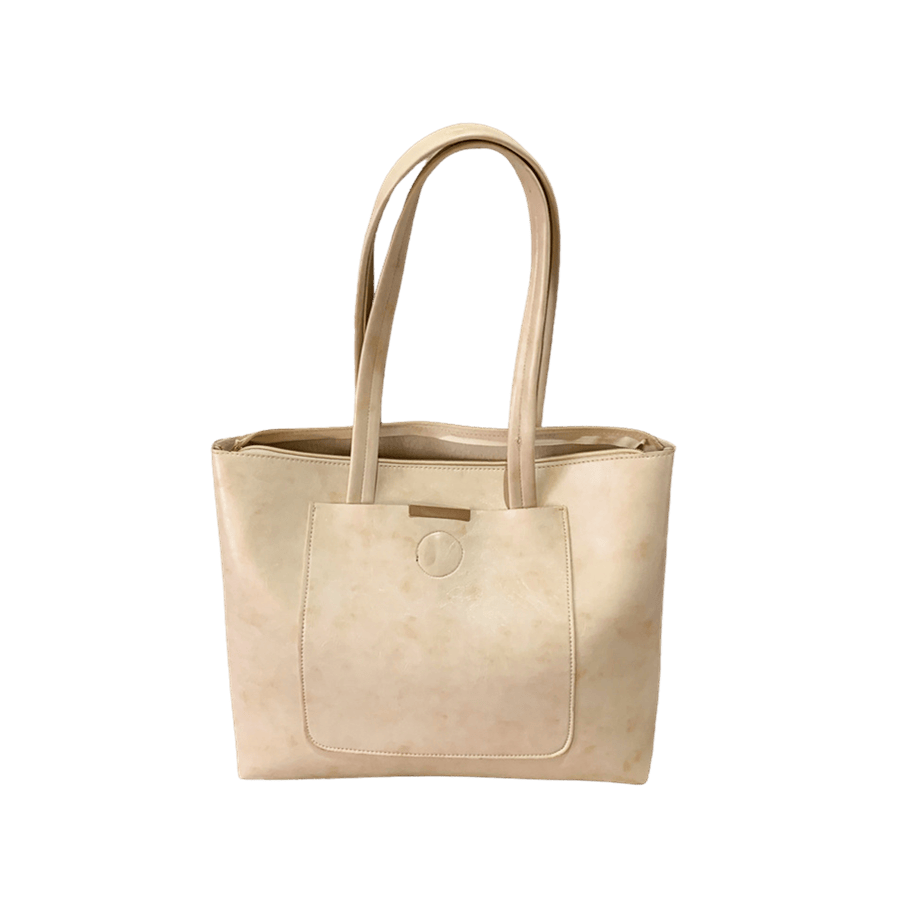 Beige ladies tote bag with metal edge on the front pocket