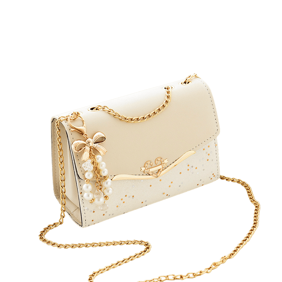 Beige ladies crossbody bag with metallic trim material and bowknot hangtag