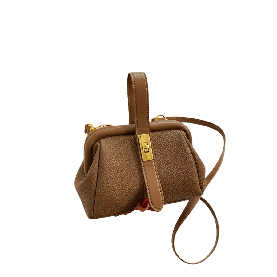Brown ladies handbag with lock closure and brown trim PU