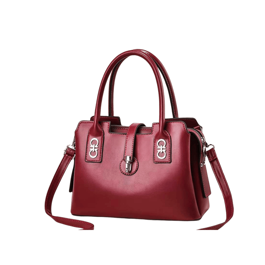 Burgundy ladies handbag with decorative hardware on the handle and lock closure