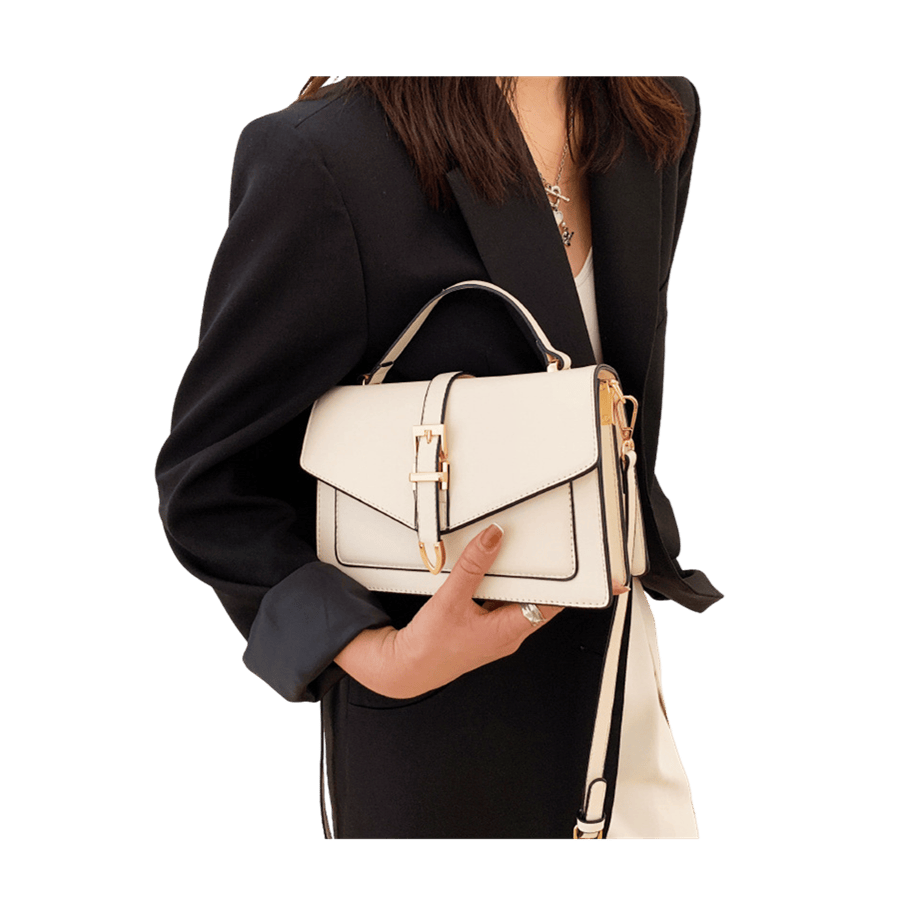 Beige ladies handbag with decorative hardwares on the flap and contrast edge painting