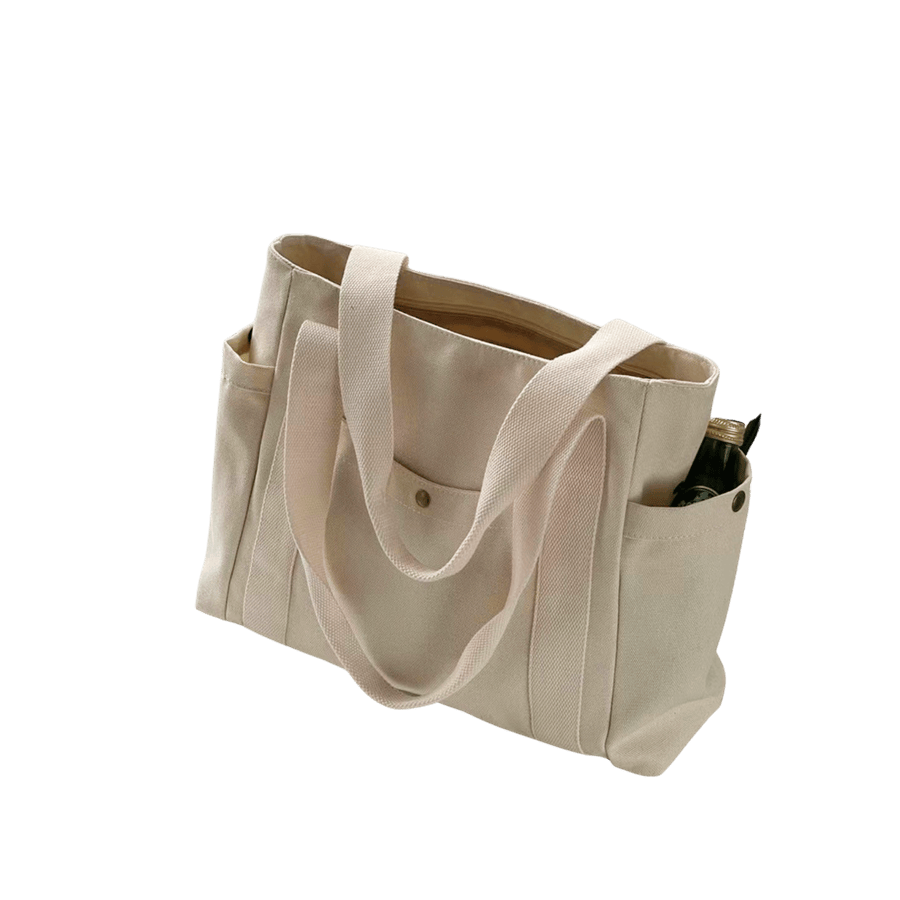 Beige canvas ladies tote with side pockets and front pocket