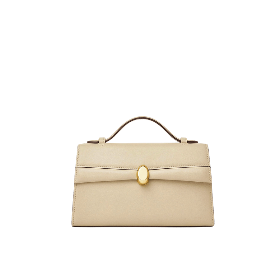 Beige ladies handbag with lock closure and contrast edge painting