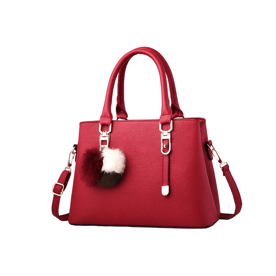 Red ladies handbag with colorful pompom and metal tab