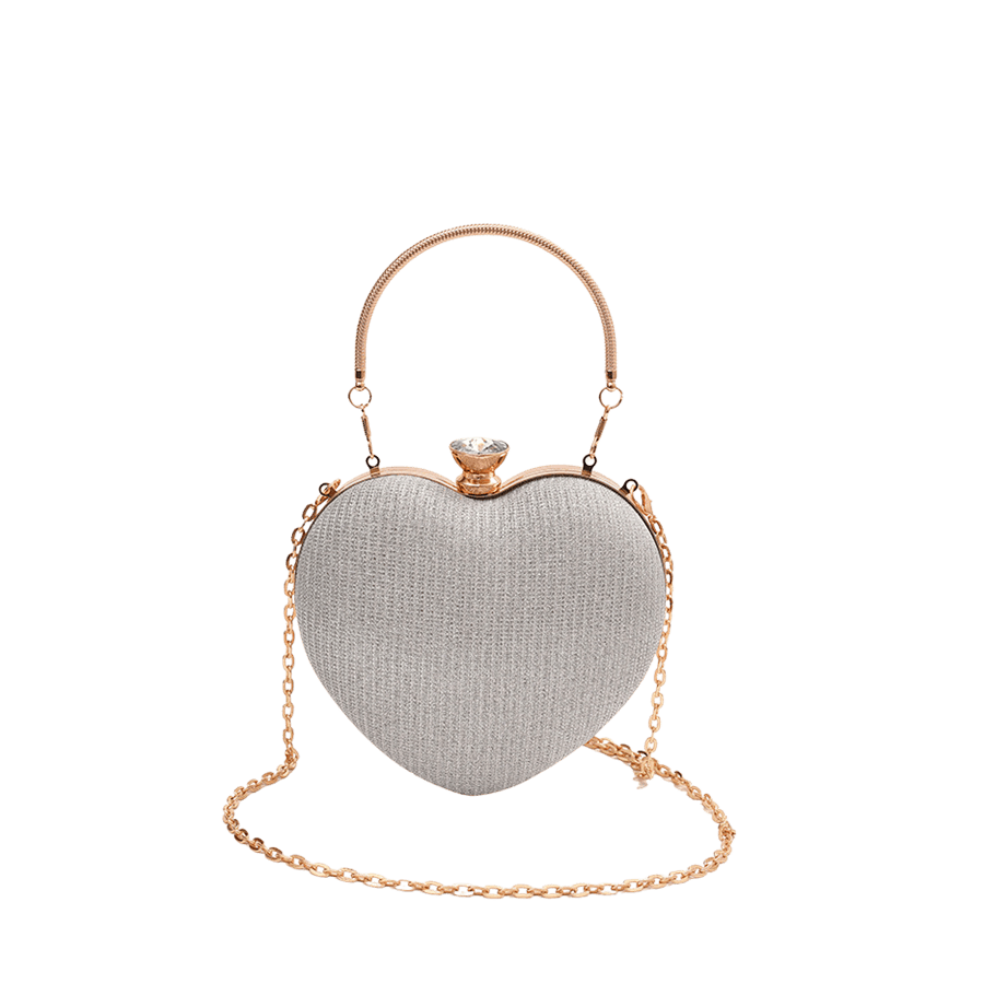 Metallic silver heart-shaped ladies clutch bag with metal handle and framed closure
