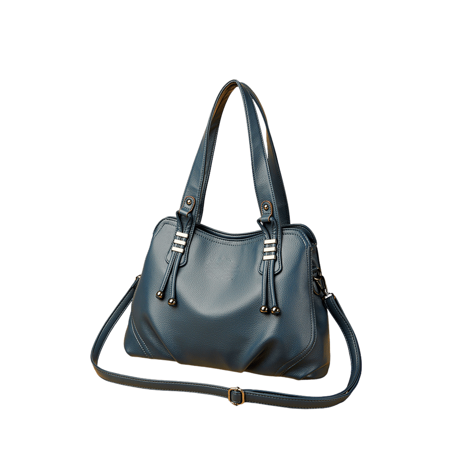 Green ladies handbag with decorative metal bridge and pleats