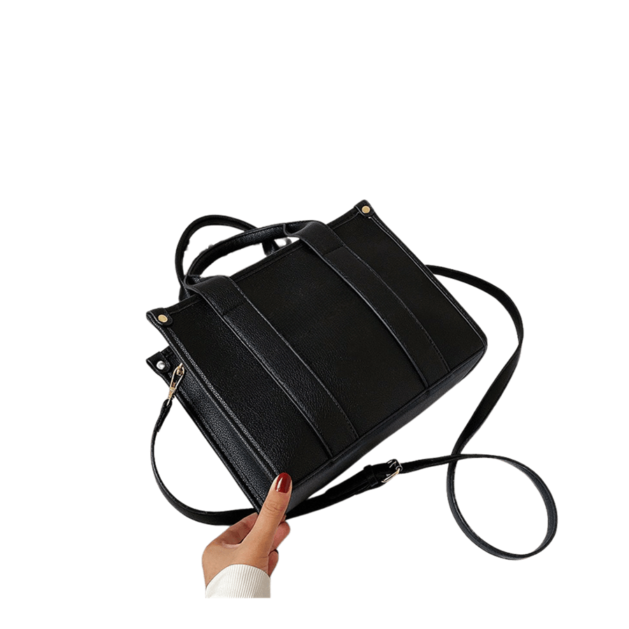 Black ladies tote with decorative studs on the top