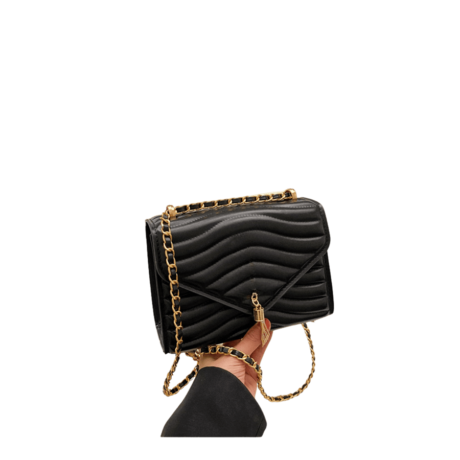 Black quilting ladies handbag with metal tassel and magnetic snap closure