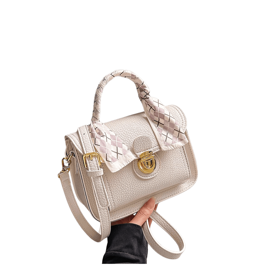 White ladies handbag with decorative scarf and lock closure