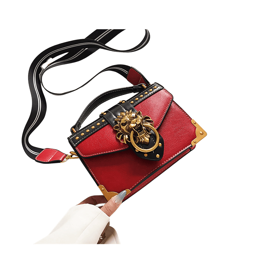 Red ladies handbag with decorative hardware nad metal corner on the bottom