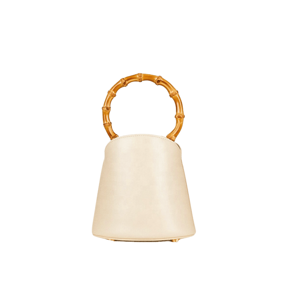 Beige ladies handbag with bamboo handle and bottom metal feets