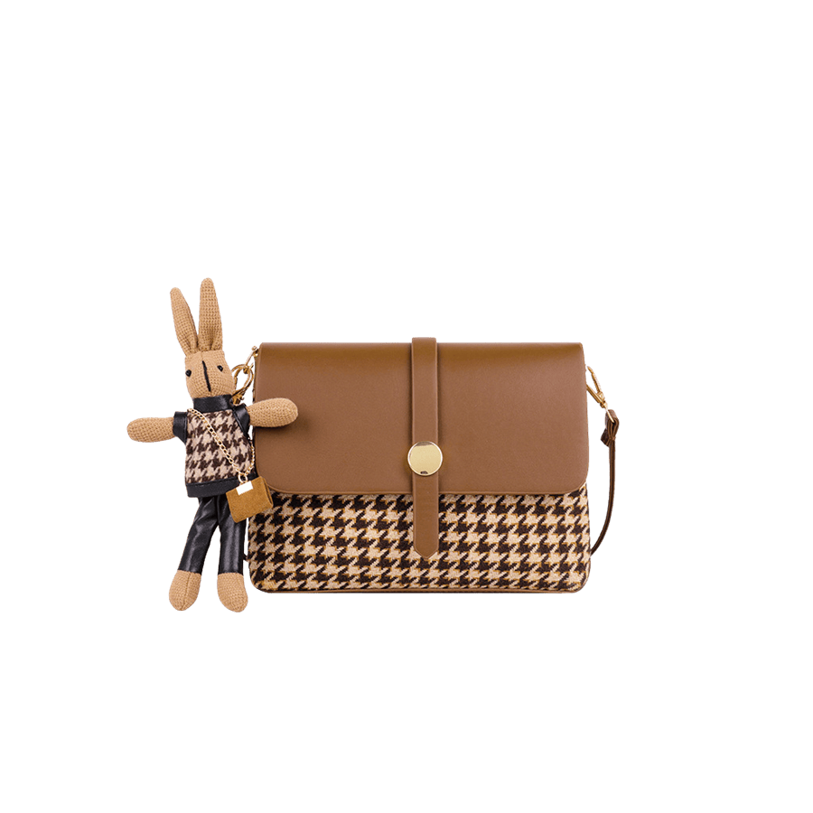 Ladies jacquard handbag with rabbit toy and decorative round hardware on the flap