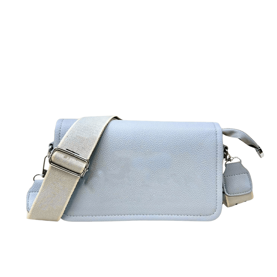 Blue ladies crossbody bag with webbing shoulder strap and magnetic snap closure