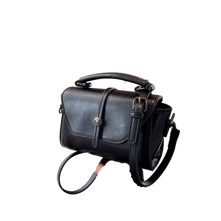 Black ladies handbag with decorative round hardware on the flap and magnetic snap closure