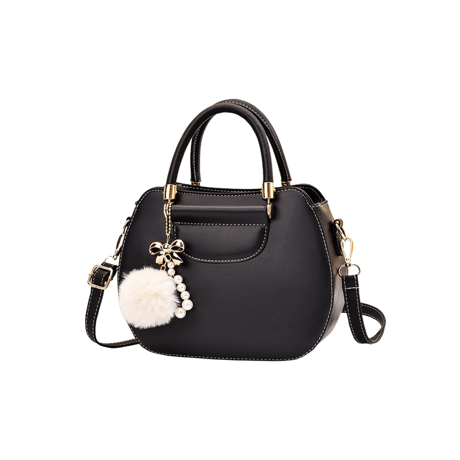 Black ladies handbag with beige pompom and metal bar on the handle