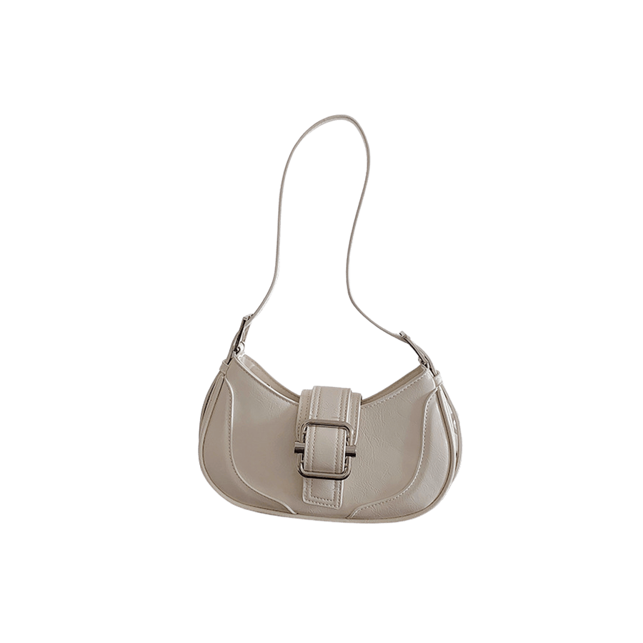 White ladies handbag with buckle on the flap and adjustable handle