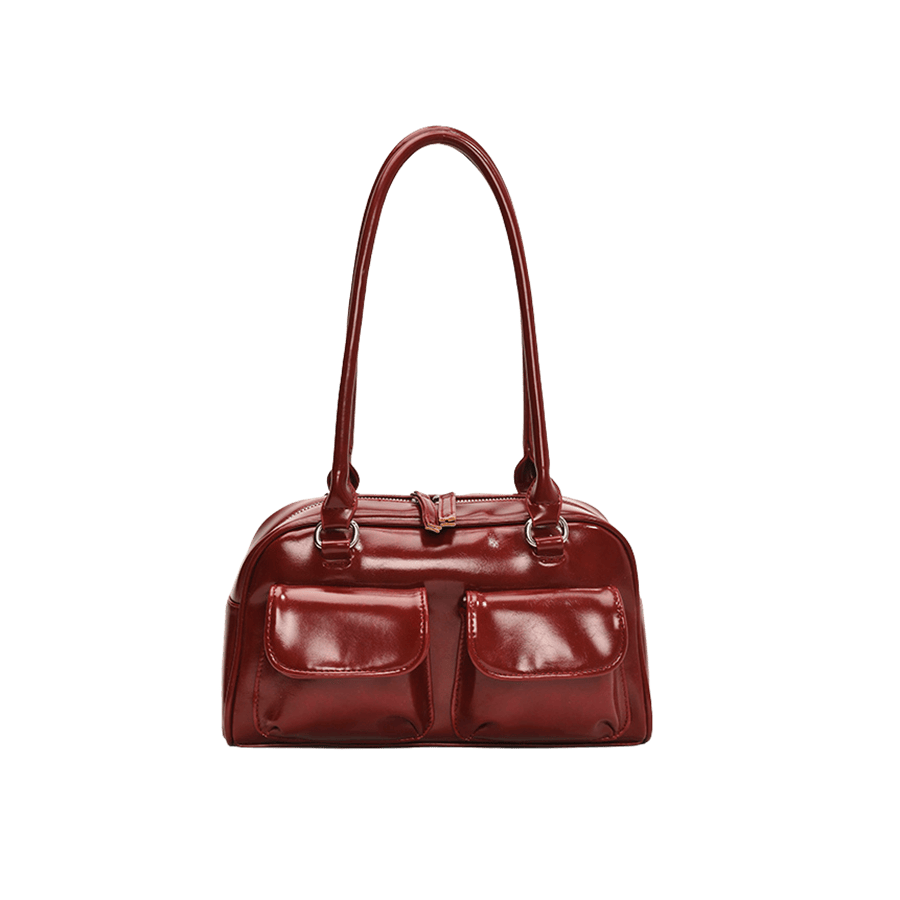 Red ladies handbag with front open pockets and double zipper puller closure
