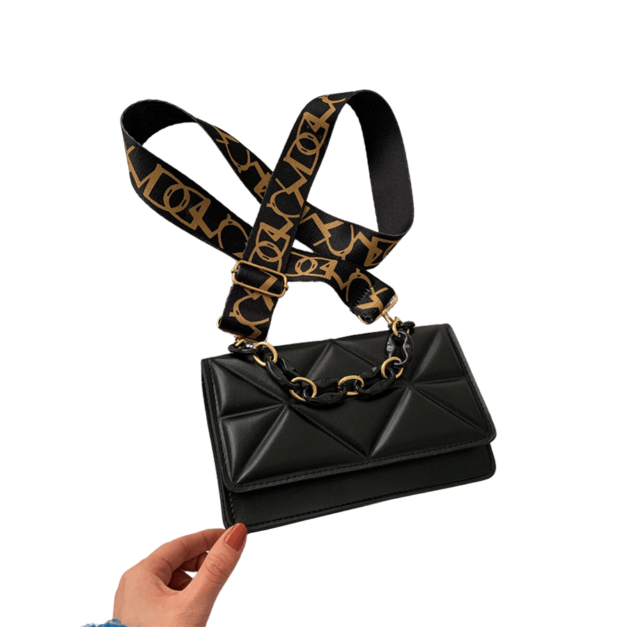 Black quilting ladies handbag with plastic handle and magnetic snap closure