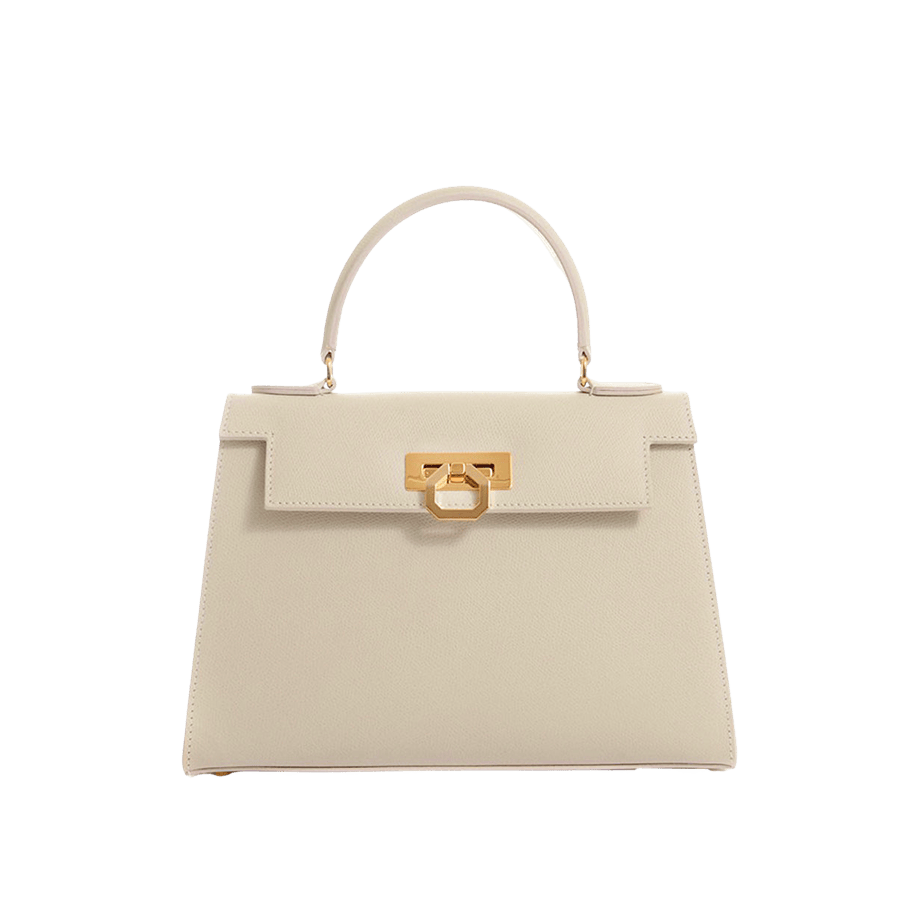 Beige ladies handbag with lock closure and bottom metal feets