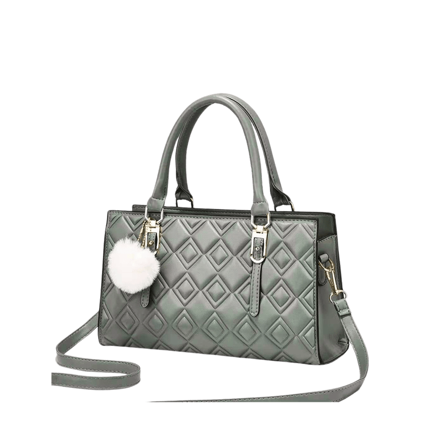 Green ladies embossed handbag with detachable pompom and metal tab