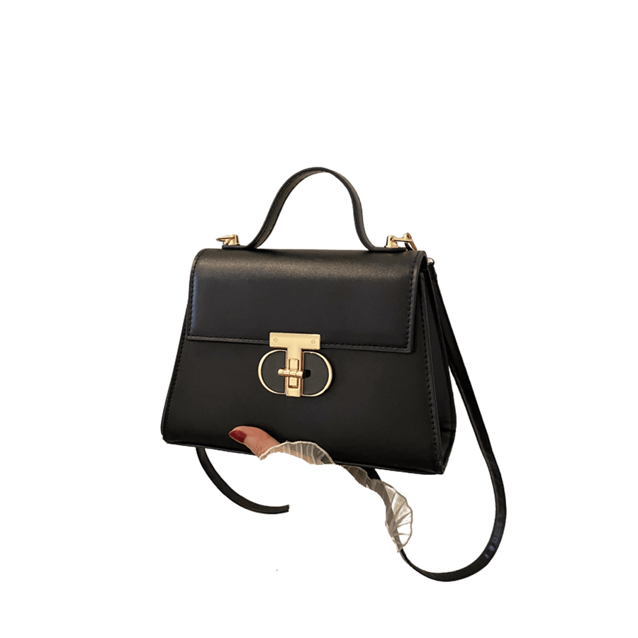 Black ladies handbag with black enemal oval lock closure and metal bridge on the top