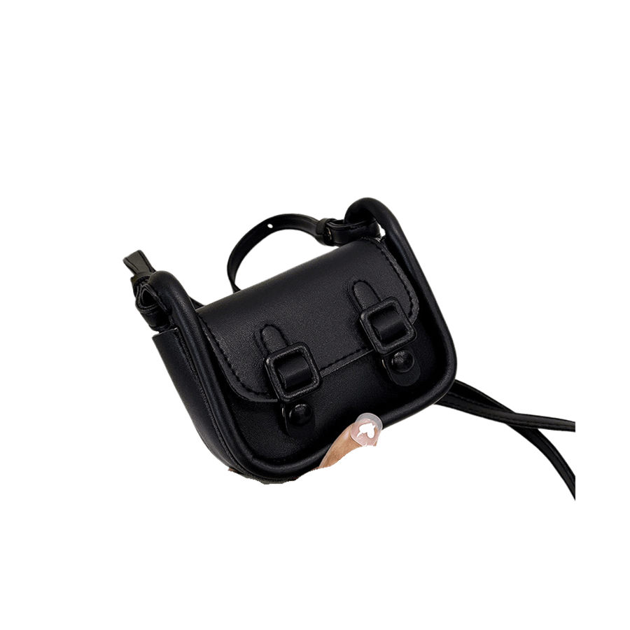 Black ladies handbag with decorative straps and magnetic snap closure