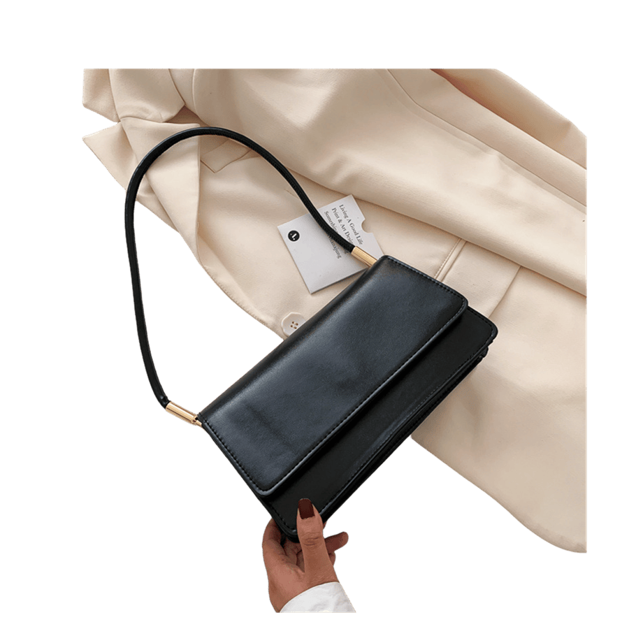 Black ladies handbag with metal tubular on the handle and magnetic snap closure