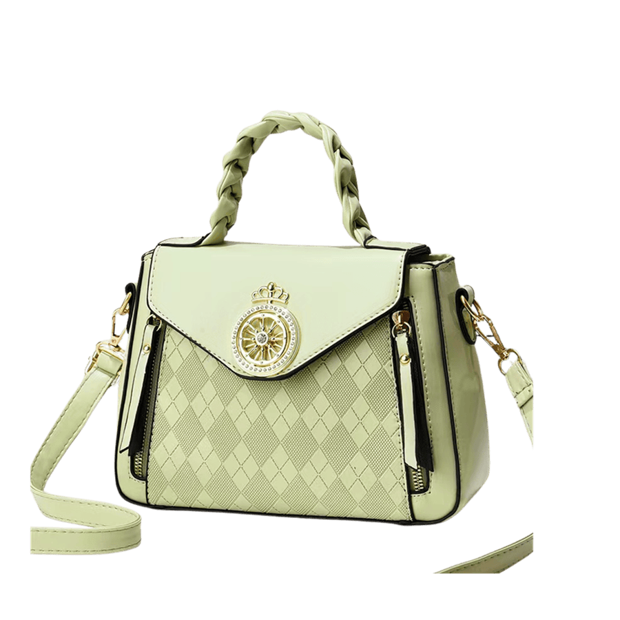 Green embossed ladies handbag with weave ahdnle and decorative hardware on the flap