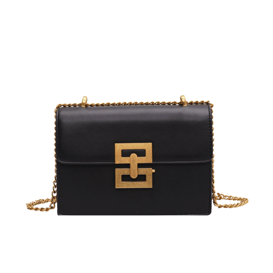 Black ladies crossbody bag with decorative hardware on the flap