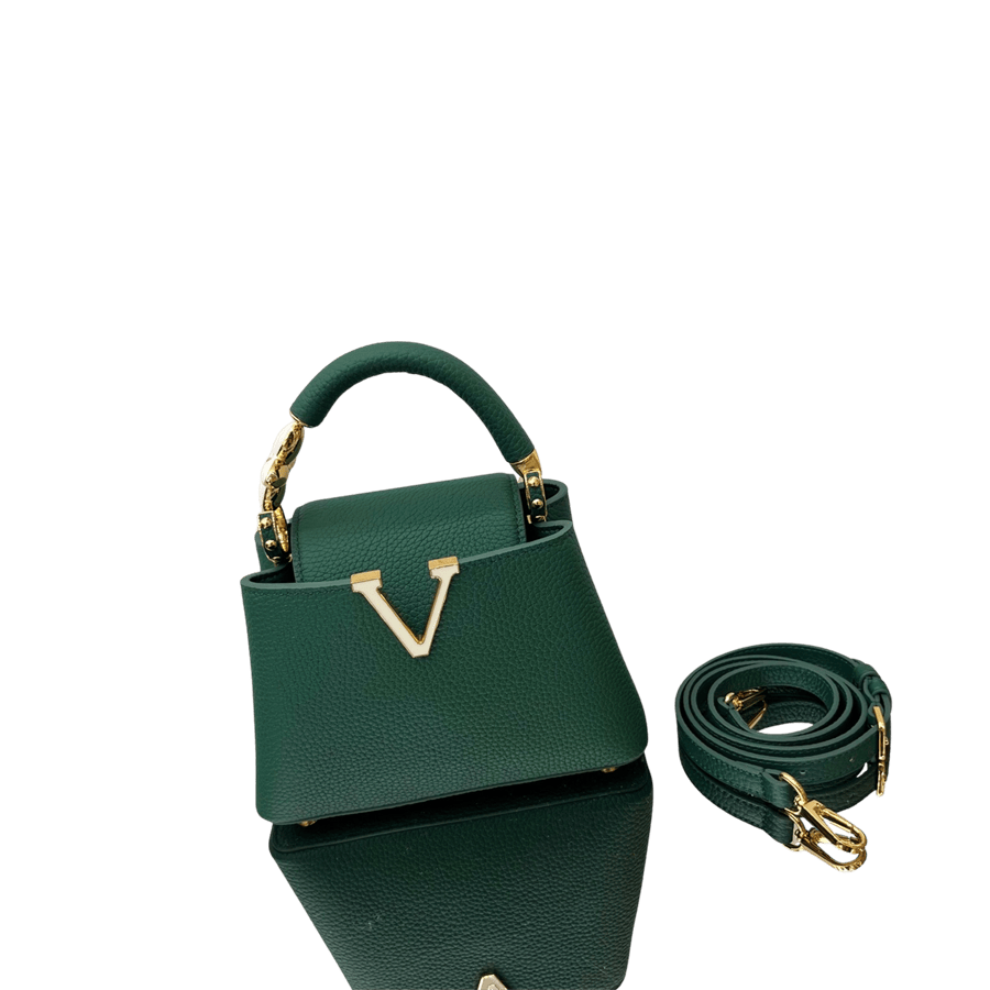 Green ladies handbag with "V"shape hardware on the front and metal tubular